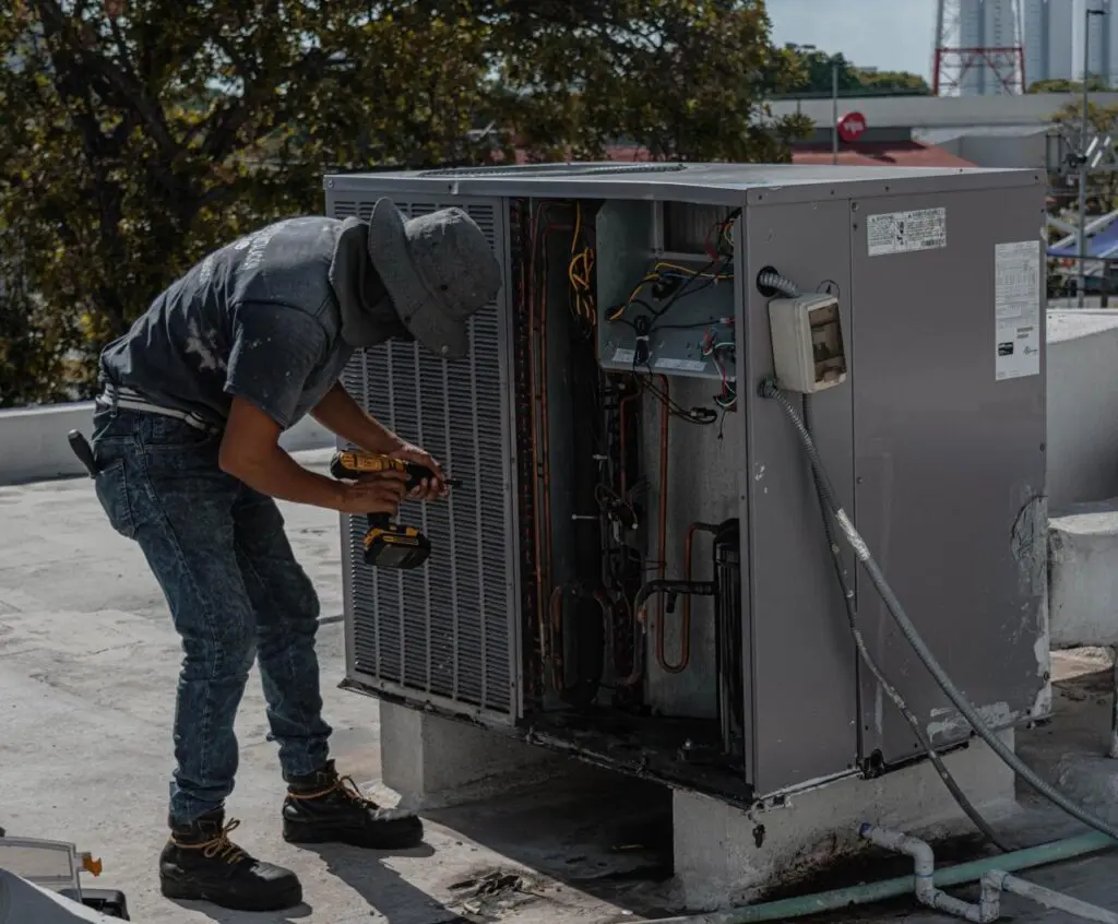 Technician performing AC maintenance for a home in Orlando, Florida